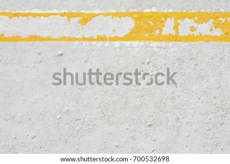 damaged yellow line on concrete floor