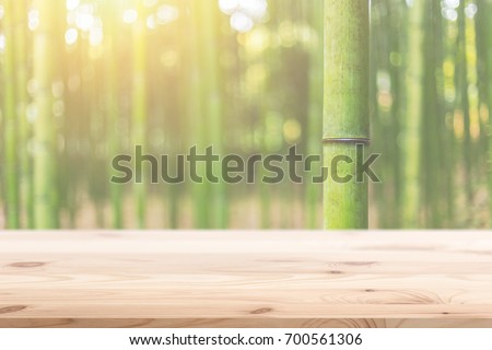 Wood foreground with blur bamboo wood forest background design for display nature products