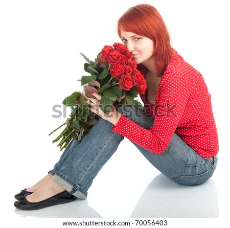 lovely woman with a bouquet of red roses