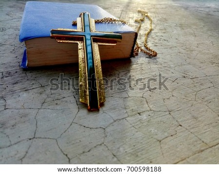 Christian Cross necklace with morning sunlight