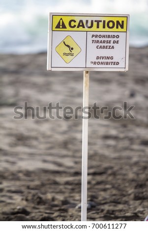 No diving sign on the beach