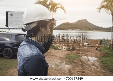 Engineers are coming to see the construction site.
This place is a reservoir in Thailand.
