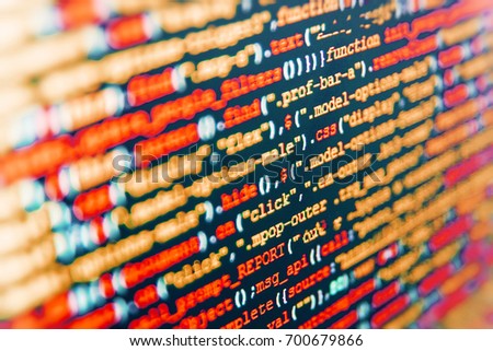 Big data and Internet of things trend. IT specialist workplace. Website HTML Code on the Laptop Display Closeup Photo. Big data storage and cloud computing representation. 