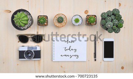 Make today amazing. Flat lay of accessories on wooden desk background of photographer.