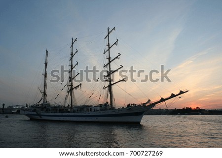 Sail on sunset on river. Travel in old style