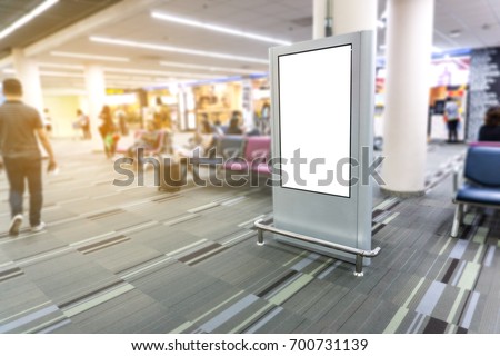 Blank mock up light box  template vertical sign stand display in Airport, Advertising banner Royalty-Free Stock Photo #700731139