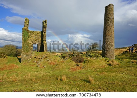 A partial winter rainbow over the abandoned ruins of the Wheal Jenkins engine house, Bodmin Moor, Cornwall, UK