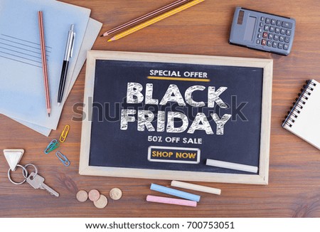 Black Friday sale. Chalkboard on wooden office desk