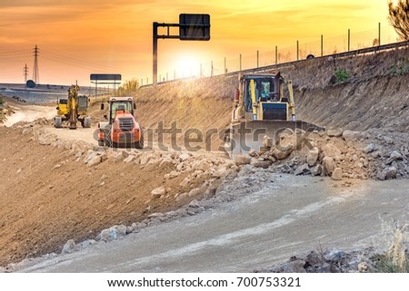 Construction work for a road Royalty-Free Stock Photo #700753321