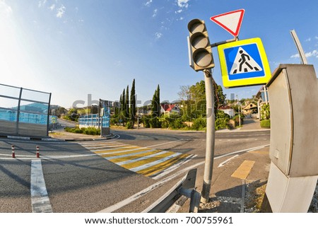 Road sign at the entrance to the highway warn about the presence of a pedestrian crossing