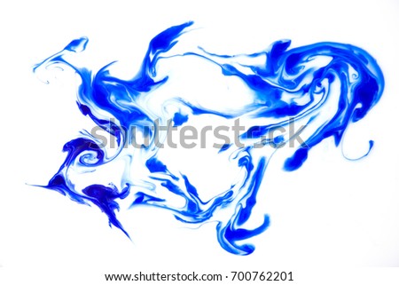 abstract background of splattered blue ink blots.