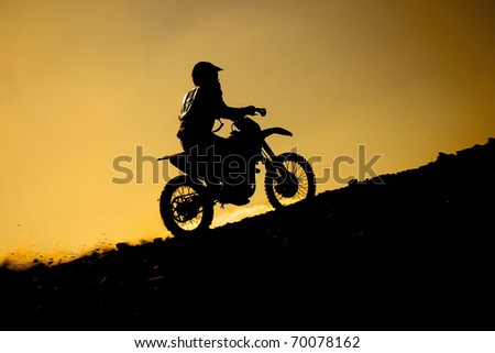 silhouette of a rider at sunset Royalty-Free Stock Photo #70078162