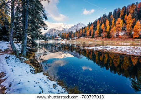 Splendid sunny scene of Antorno lake, Tre Cime di Lavaredo National park. Colorful autumn landscape of Dolomite Alps, Province of Belluno, Italy, Europe. Beauty of nature concept background.
