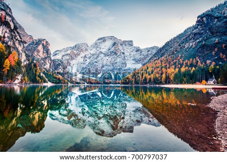 First snow on Braies Lake. Colorful autumn landscape in Italian Alps, Naturpark Fanes-Sennes-Prags, Dolomite, Italy, Europe. Beauty of nature concept background.
