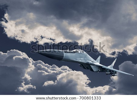 Airplane fighter in the clouds. Fighter in attack