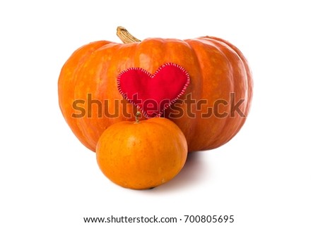 Two pumpkins and textile heart, isolated over white. Great for Thanksgiving