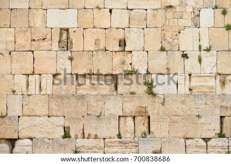 The Western wall or Wailing wall is the holiest place to Judaism in the old city of Jerusalem, Israel. Royalty-Free Stock Photo #700838686