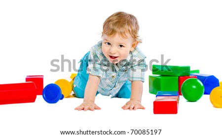 Cute little baby boy with colorful building block