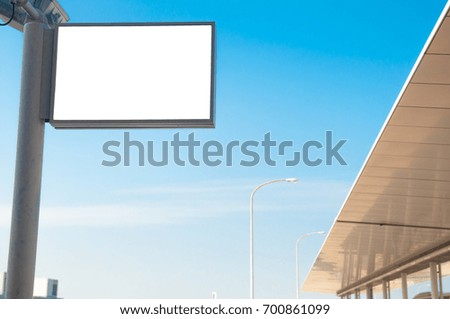 White isolated board with blue sky and roofing.