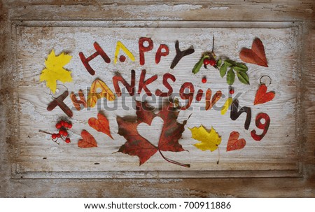 Happy Thanksgiving lettering background with autumn leaves