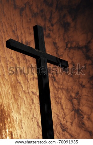 cross silhouette with the sunset as background
