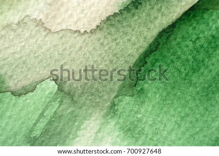 great green watercolor background - watercolor paints on a rough texture paper