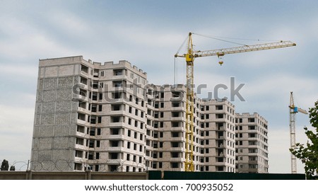 Construction site. Crane near building