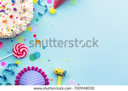 Colorful birthday party background with birthday cake and party hats
