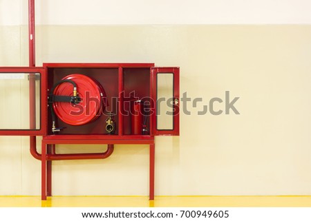 Red cabinet (The door was opened) for Fire Extinguisher, Fire Hose and Fire Hose Valve