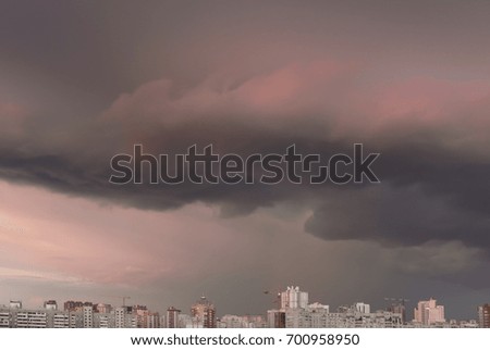 Clouds over the city at sunrise