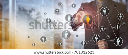 Blue chip recruitment agent highlighting a male white collar worker in a virtual network. HR concept for search for talented employees, qualified staff, marketing and peer to peer networking. Royalty-Free Stock Photo #701012623