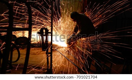 Industrial worker with work tool Royalty-Free Stock Photo #701021704