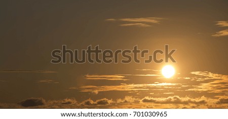 Direct photo of sun and some clouds