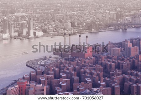 Urban landscape of NYC (USA), view of Brooklyn and Manhattan from the Empire State Building, Brooklyn is grey and Manhattan pink tinted
