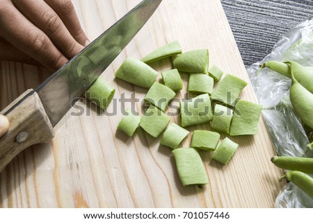 Fresh green beans ready to eat, green bean with knife,