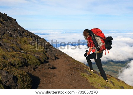 Photographer on the crater of Pico Volcano, Pico Island, Azores, Portugal, Europe