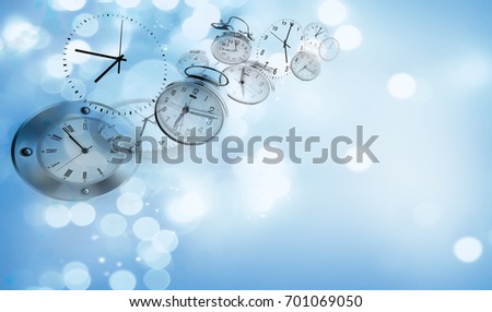 Assorted clocks on blue abstract background