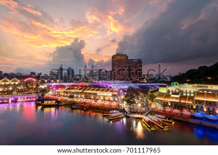 Colorful light building at night in Clarke Quay, Singapore. Clarke Quay, is a historical riverside quay in Singapore. Royalty-Free Stock Photo #701117965