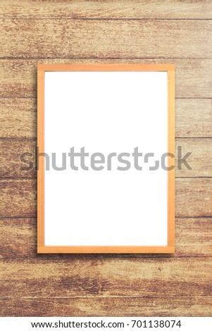 White poster with wood frame mockup on wooden wall background. mock up.