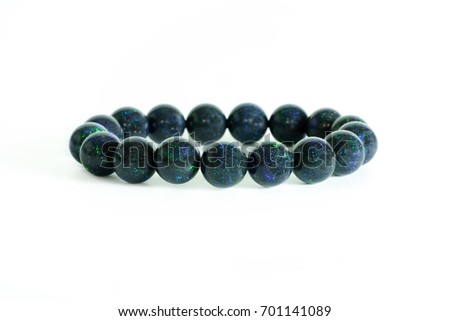 Beautiful rare Black Opal beads in bracelet on white background