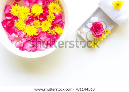 Thai Spa relax Treatments and massage with pink rose and yellow flower on wooden white.  Healthy Concept. select and soft focus