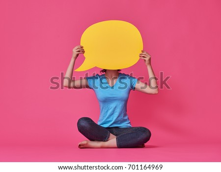 Beautiful young woman with cartoon speech on colorful background. Yellow, pink and blue colors.