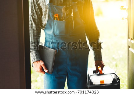worker, service man, plumber or electric Royalty-Free Stock Photo #701174023
