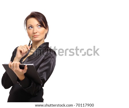 Portrait of a young female entrepreneur thinking while taking notes against white background