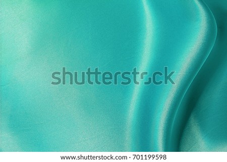 smooth satin turquoise fabric background / turquoise silk 