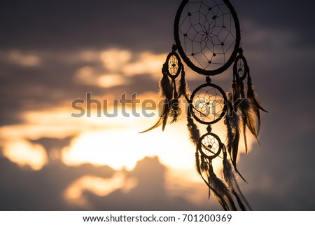 Dream Catcher on the sunset background Royalty-Free Stock Photo #701200369
