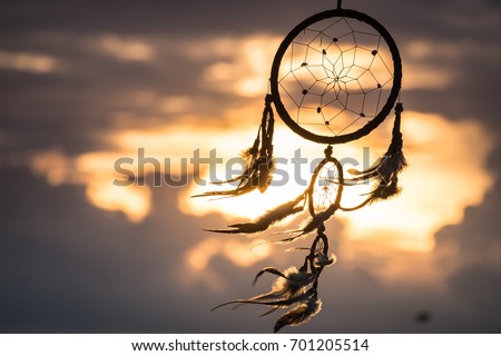 Dream Catcher on the sunset background Royalty-Free Stock Photo #701205514