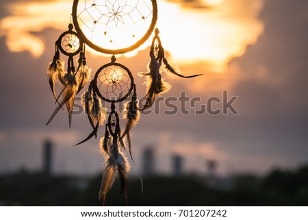 Dream Catcher on the sunset background Royalty-Free Stock Photo #701207242