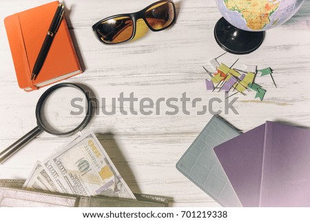 Overhead view of Traveler's accessories, Essential vacation items