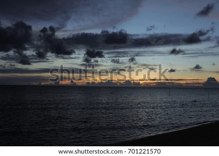 Beautiful sunset views and calm waves as a backdrop. On the coast of Indonesia